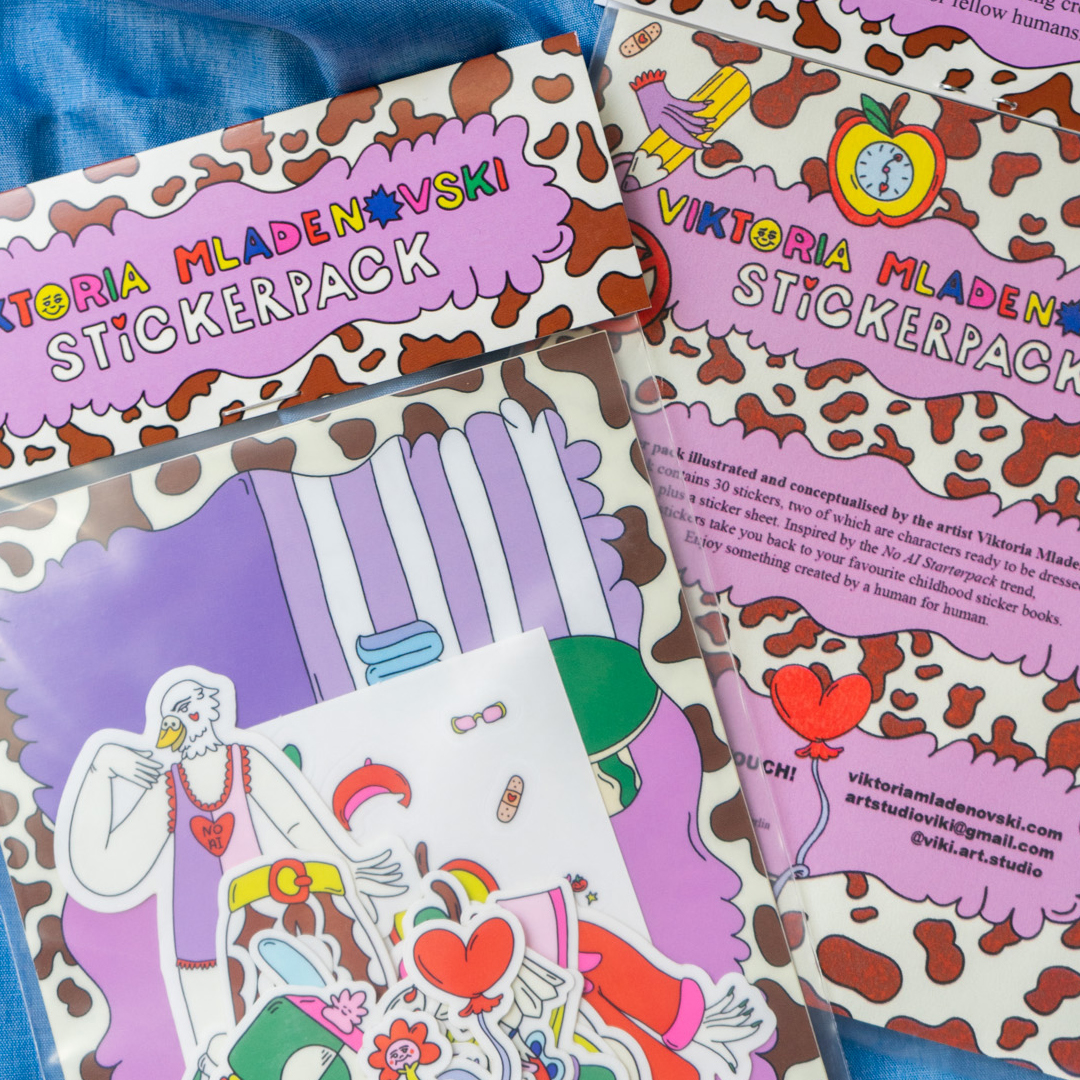 Sticker packs made by Viktoria Mladenovski, filled with transparent sticker in different characters, against a blue fabric.