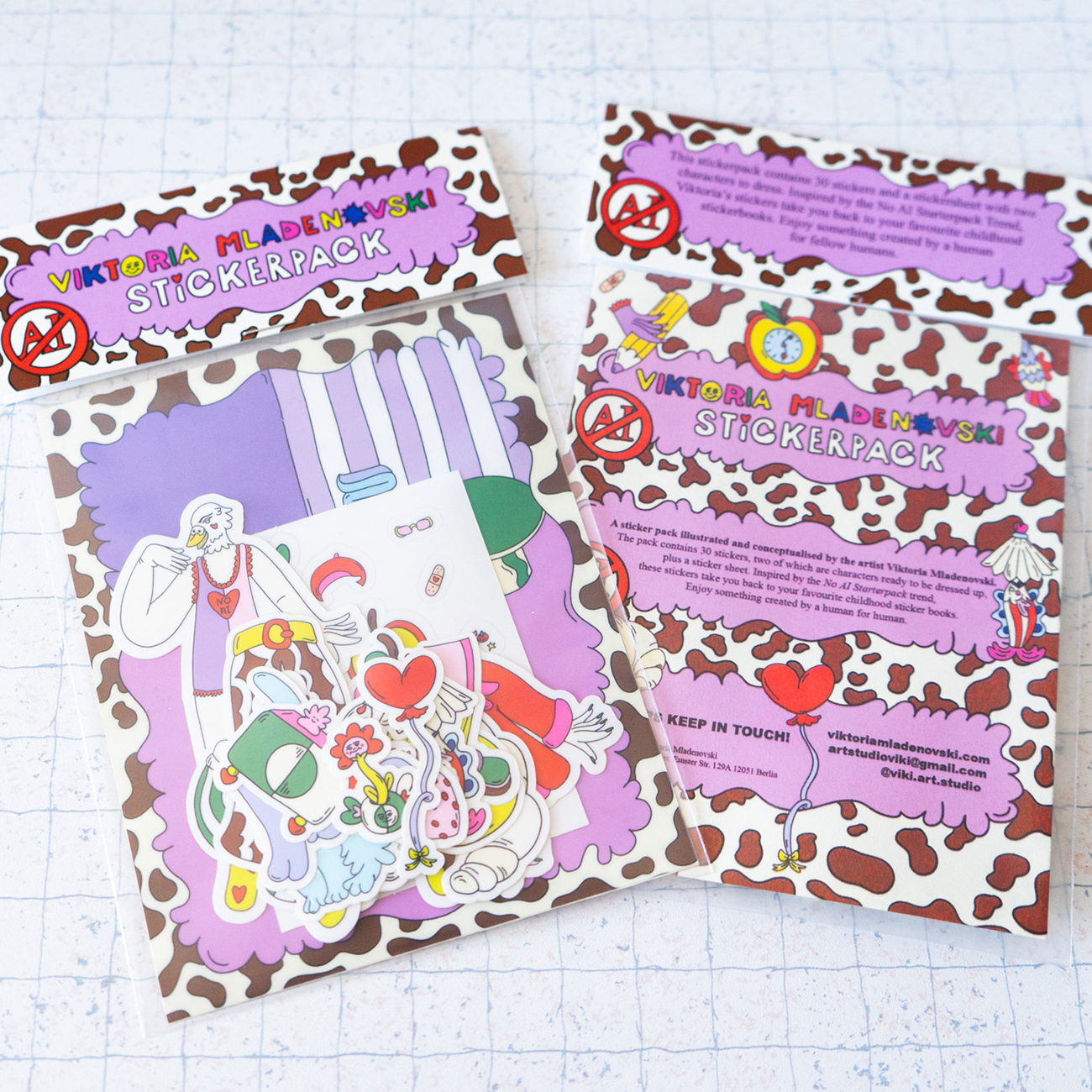 Sticker Packs with multiple transparent stickers for collage, with a back paper print including illustrations and text, against a light background