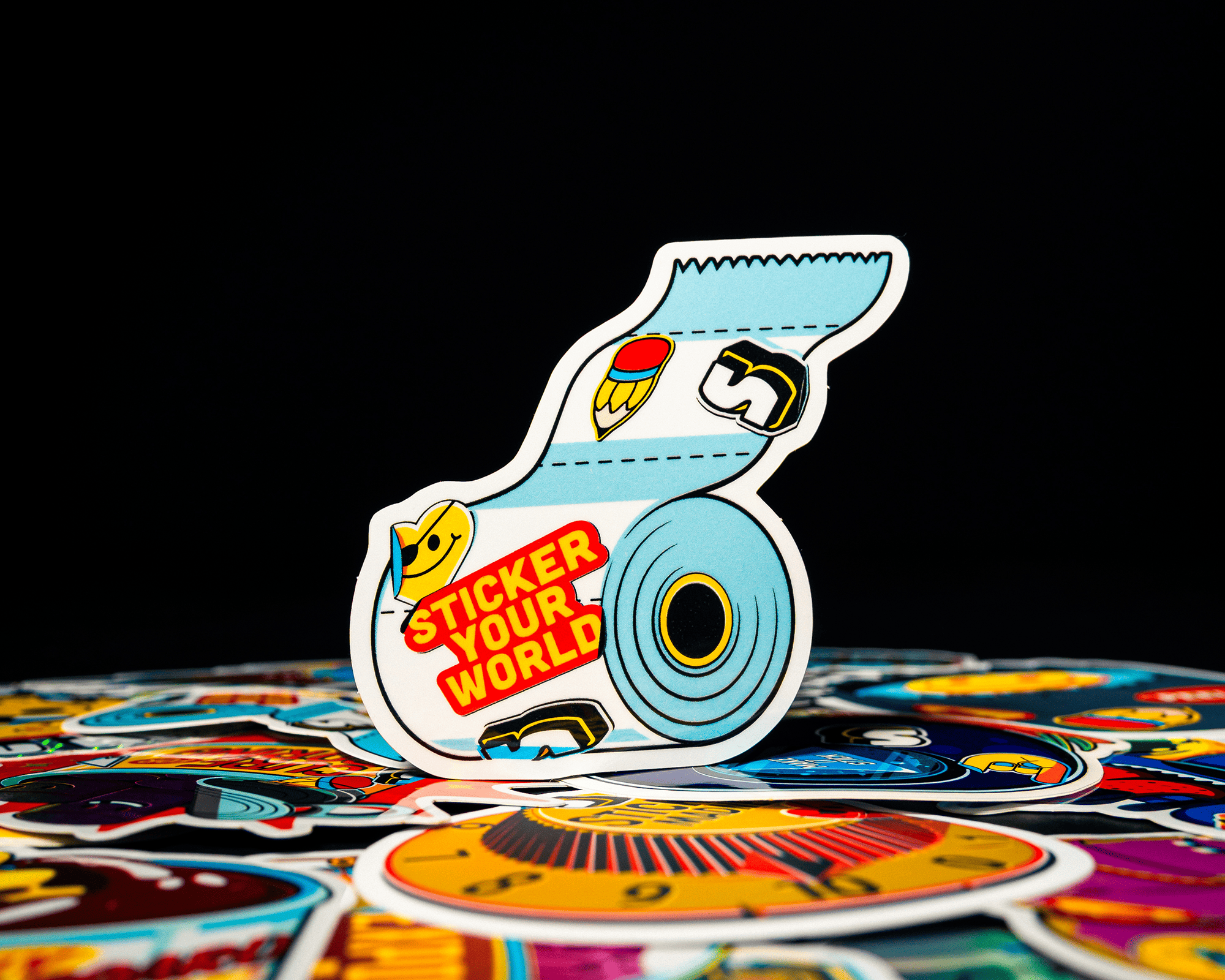 A colorful sticker of a toilet roll with the text "STICKER YOUR WORLD"