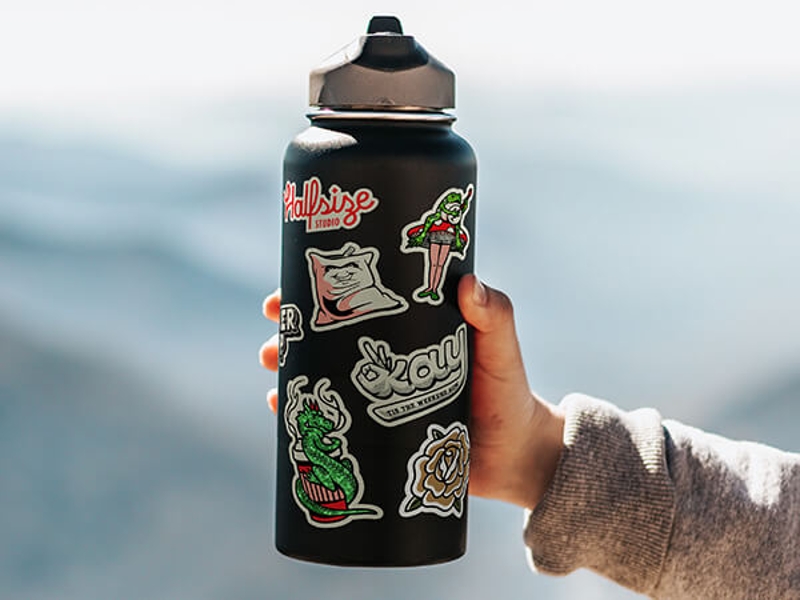 Several Die cut stickers on water bottle.